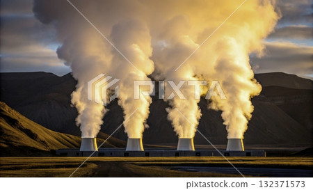 Steam rises from geothermal power plant in a mountainous landscape at sunset 132371573