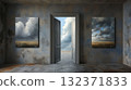 A room with paintings and an open door behind which you can see the sky 132371833