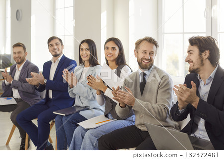 Business People Applauding Success In Office Meeting 132372481