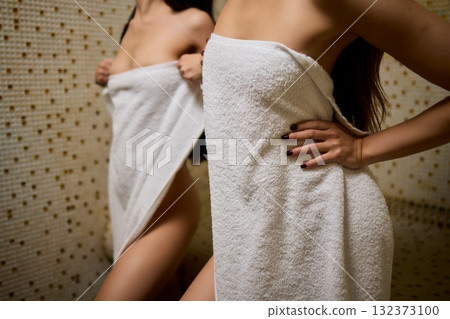 Elegant Spa Retreat A Group of Women Enjoying Moments of Relaxation Wrapped in Towels 132373100