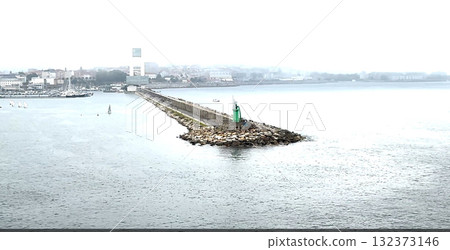 Harbor View With a Lighthouse and a Long Pier in Galica Spain 132373146