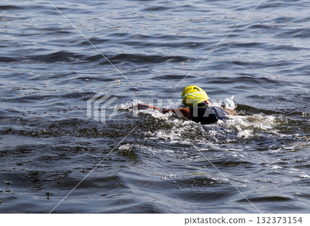 Swimmer Gliding Through the Calm Water iof the bay n Morning Light 132373154