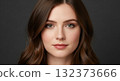 A striking rear view of a woman with beautiful hair dyed a vibrant medium brown color 132373666