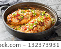 Cheesy Creamy Million Dollar Chicken Casserole with crispy bacon and almonds closeup on the pan. Horizontal 132373931