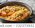 Million Dollar Chicken features juicy baked chicken topped with a creamy, cheesy layer, crispy bacon and almonds closeup on the pan. Horizontal 132373932