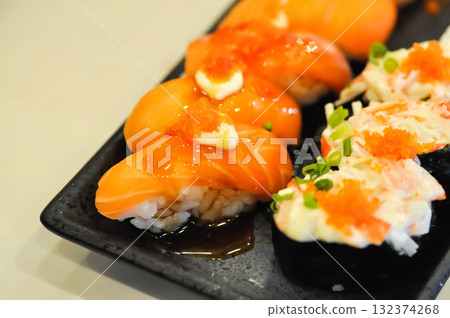 salmon sushi ,sushi or rice topped with salmon or salmon roll and shrimp egg 132374268