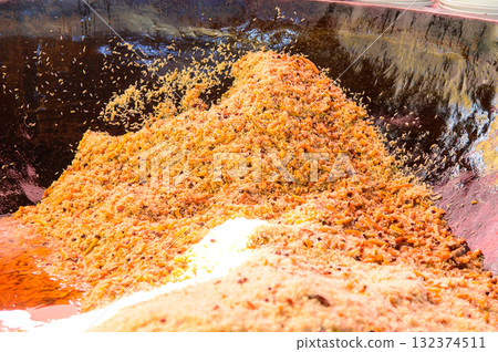Delicious plov, a famous national dish of Uzbekistan, cooked in a large pot. 132374511
