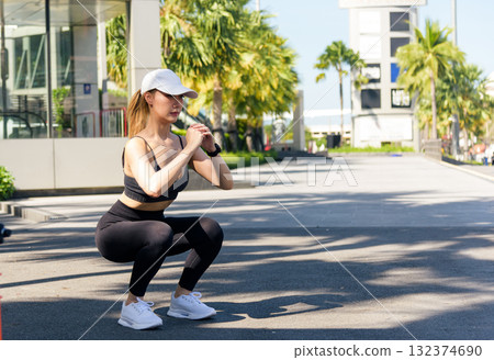 Sport woman workout outdoor exercise, fit people showing strong physique, healthy active lifestyle, urban sport training street scene 132374690