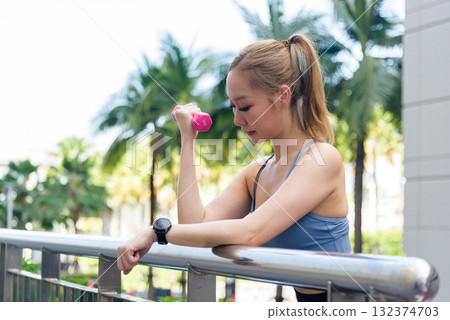 Fit woman sport workout outdoor, exercise people actively stretch, building muscle strength, promoting healthy lifestyle, performing another light stretch for flexibility and recovery Fit woman sport workout outdoor, exercise people actively stretch, building muscle strength, promoting healthy lifestyle, performing another light stretch for flexibility and recovery 132374703