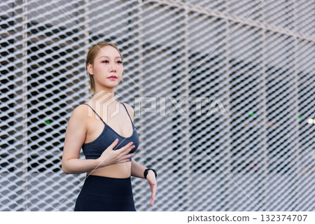 Exercise woman performs sport workout, fit body preparing for outdoor activity, people focused on healthy lifestyle, dynamic stretch overall wellbeing, fitness, strong body and mindful exercise Exercise woman performs sport workout, fit body preparing for outdoor activity, people focused on healthy lifestyle, dynamic stretch overall wellbeing, fitness, strong body and mindful exercise 132374707