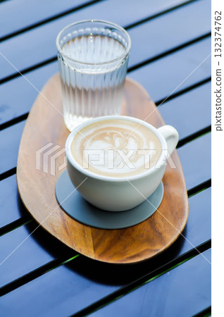 hot cofffee, cappuccino coffee or latte coffee or flat white and water 132374762