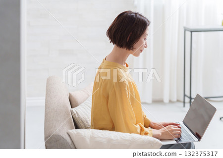 A woman working on a computer A woman working on a computer 132375317