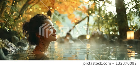Foreign tourists enjoying the autumn hot springs inn, gently enveloped in steam 132376092