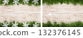 Christmas frame made of fir branches decorated with snowflakes on a light wooden background 132376145