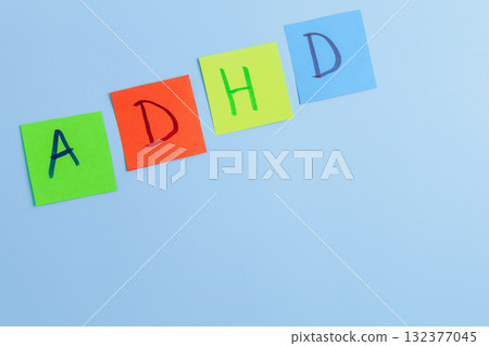 ADHD abbreviation on multi-colored paper. Attention Deficit Hyperactivity Disorder concept ADHD abbreviation on multi-colored paper. Attention Deficit Hyperactivity Disorder concept 132377045