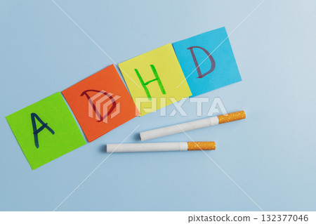 ADHD abbreviation on multi-colored paper and cigarettes. Attention Deficit Hyperactivity Disorder concept ADHD abbreviation on multi-colored paper and cigarettes. Attention Deficit Hyperactivity Disorder concept 132377046