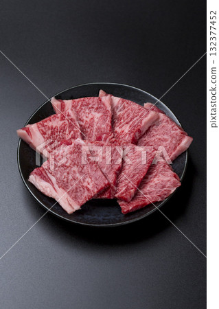 Grilled Wagyu beef ribs on a black background Grilled Wagyu beef ribs on a black background 132377452