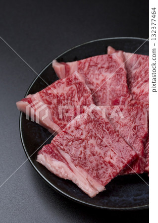 Grilled Wagyu beef ribs on a black background Grilled Wagyu beef ribs on a black background 132377464