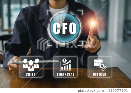 CFO concept image featuring business icons and executive interacting with digital interface in a modern office environment. 132377591