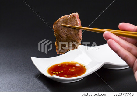 Grilled Wagyu beef ribs on a black background Grilled Wagyu beef ribs on a black background 132377746