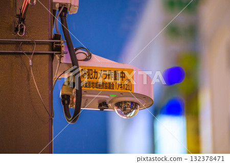 Tokyo cityscape in Japan. Security cameras on street corners in operation. Security cameras at the Akihabara Station Electric Town Exit, even in the rain. 132378471