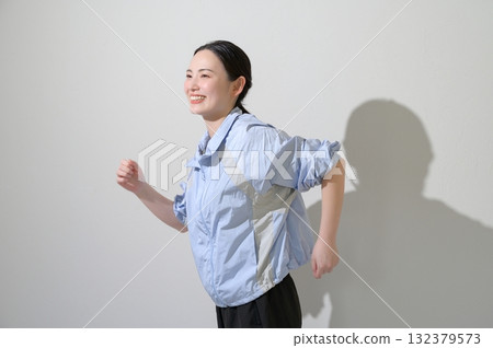 A woman playing sports on a white background A woman playing sports on a white background 132379573