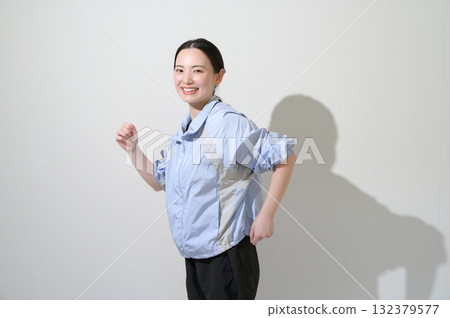 A woman playing sports on a white background A woman playing sports on a white background 132379577