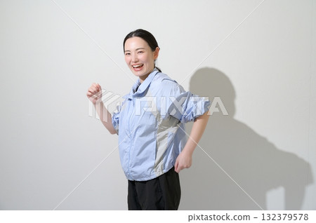 A woman playing sports on a white background 132379578