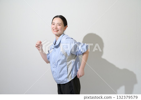 A woman playing sports on a white background 132379579