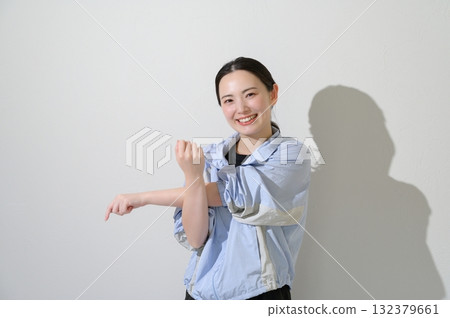 Japanese woman stretching on white background 132379661