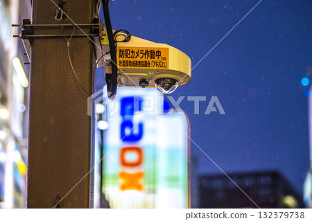 Tokyo cityscape in Japan. Security cameras on street corners in operation. Security cameras at the Akihabara Station Electric Town Exit, even in the rain. Tokyo cityscape in Japan. Security cameras on street corners in operation. Security cameras at the Akihabara Station Electric Town Exit, even in the rain. 132379738
