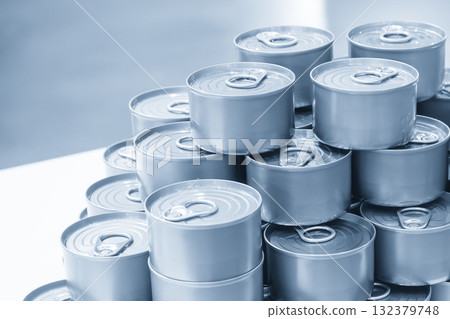 The piles of tinned can food in the blue tone scene. The piles of tinned can food in the blue tone scene. 132379748