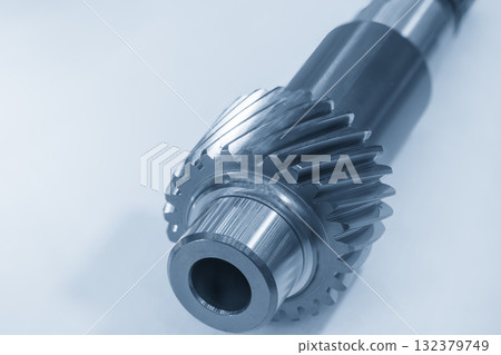 Close up the transmission bevel gear spare parts in the light blue scene. Close up the transmission bevel gear spare parts in the light blue scene. 132379749