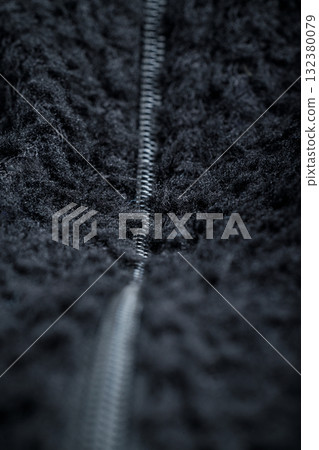 Zipper on black fleece background close-up 132380079