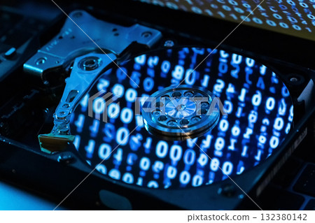 A hard disk with a blue binary code 132380142