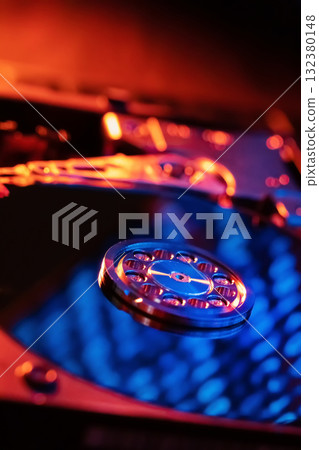 A hard disk with a blue binary code A hard disk with a blue binary code 132380148