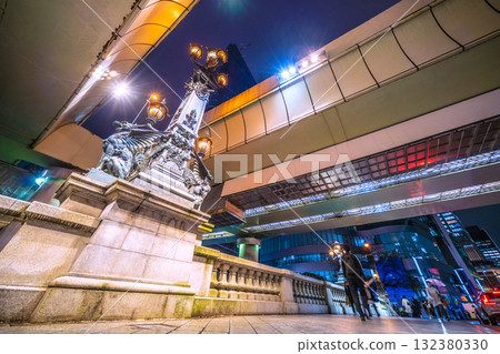 Tokyo cityscape in Japan - Nihonbashi at night. Beautiful lights under the Metropolitan Expressway overpass... Nihonbashi 1-chome redevelopment project visible from between the roads Tokyo cityscape in Japan - Nihonbashi at night. Beautiful lights under the Metropolitan Expressway overpass... Nihonbashi 1-chome redevelopment project visible from between the roads 132380330