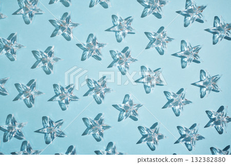 Pattern of transparent stars on a blue background. 132382880