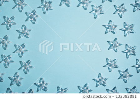 Frame of transparent stars on a light blue background. Copy space. Frame of transparent stars on a light blue background. Copy space. 132382881