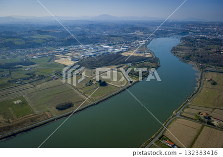 Scenic aerial view of the Adour river in Urt, Landes region 132383416