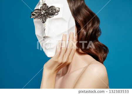 Beautiful Woman Wearing Mask. Mysterious Girl with Nice Masquerade Accessories. Carnival, Halloween or Christmas Style Beautiful Woman Wearing Mask. Mysterious Girl with Nice Masquerade Accessories. Carnival, Halloween or Christmas Style 132383533