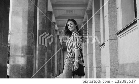 Street Style Outdoors Portrait of Cute Girl. Fashion Woman Smiling. She wearing Print Shirt, Jeans, Bag. Happy Lifestyle 132383537