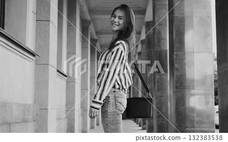 Street Style Outdoors Portrait of Beautiful Girl. Fashion Woman Smiling. She wearing Print Shirt, Jeans, Bag. Lifestyle Street Style Outdoors Portrait of Beautiful Girl. Fashion Woman Smiling. She wearing Print Shirt, Jeans, Bag. Lifestyle 132383538