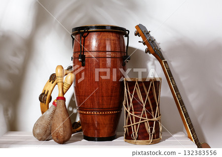 Composition of musical ethnic instrument. Maracas, tambourine, conga and ethnic drum. Percussion rhytm instruments Composition of musical ethnic instrument. Maracas, tambourine, conga and ethnic drum. Percussion rhytm instruments 132383556
