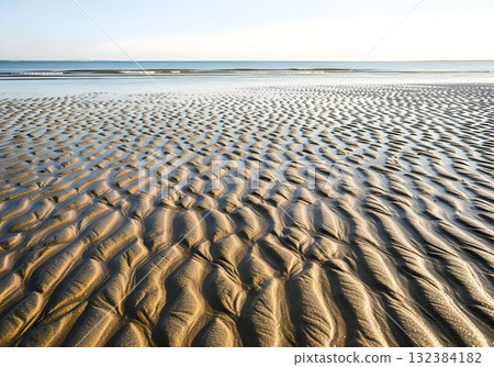 Low Tide Sand Ripples on a Calm Beach 132384182