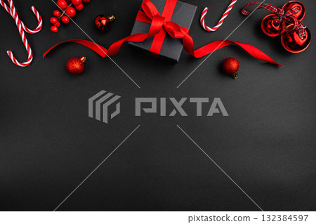 Minimalist Christmas Flat Lay with Red Decorations and Gift Box 132384597
