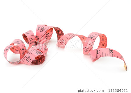 Pink tailor measuring tape with black markings coiled and twisted in loops isolated on white background Pink tailor measuring tape with black markings coiled and twisted in loops isolated on white background 132384951