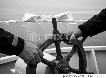 Teamwork navigating a ship through an icy sea. Close-up of hands on a wooden steering wheel with an iceberg in the background. Leadership and guidance concept 132385130