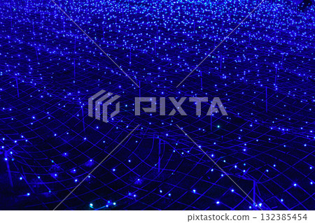 Futuristic background of blue led lights arranged in grid pattern, network, glowing at night Futuristic background of blue led lights arranged in grid pattern, network, glowing at night 132385454