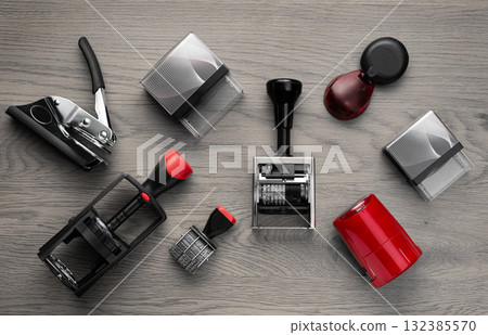 Various rubber stamps on wooden table, top view Various rubber stamps on wooden table, top view 132385570